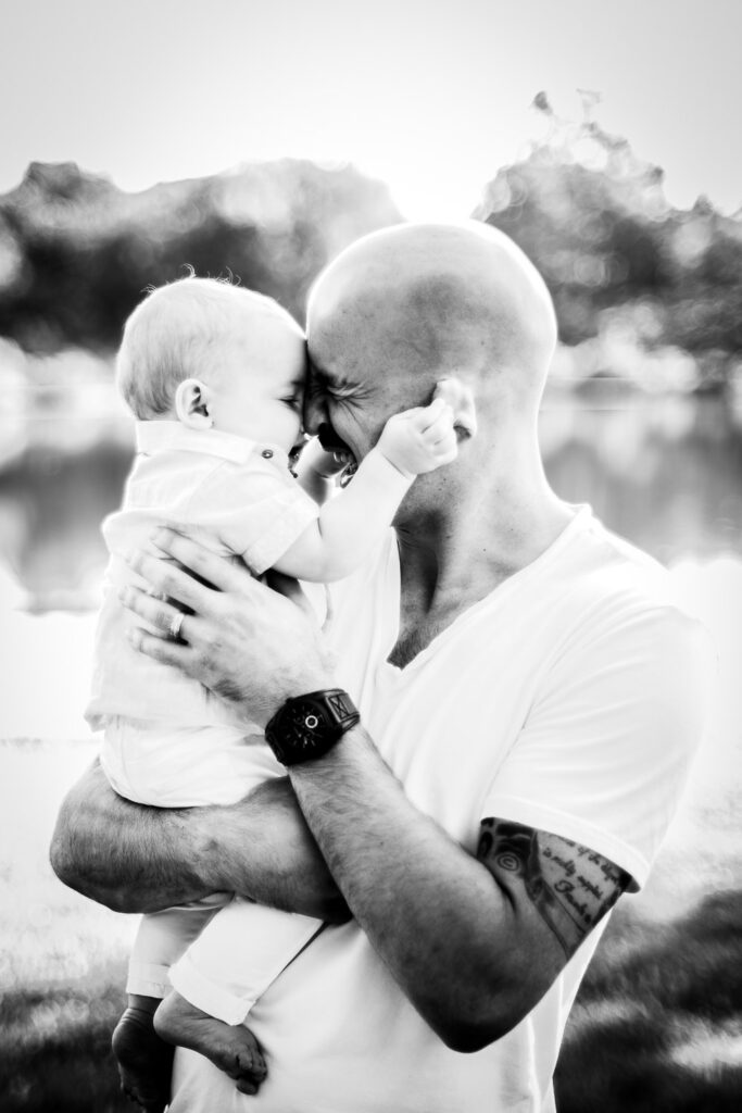 son pulling on fathers ears